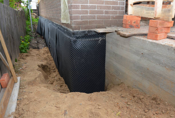 SJ Waterproofing Pros technician performing targeted Waterproofing assessment in Pitsburg, OH